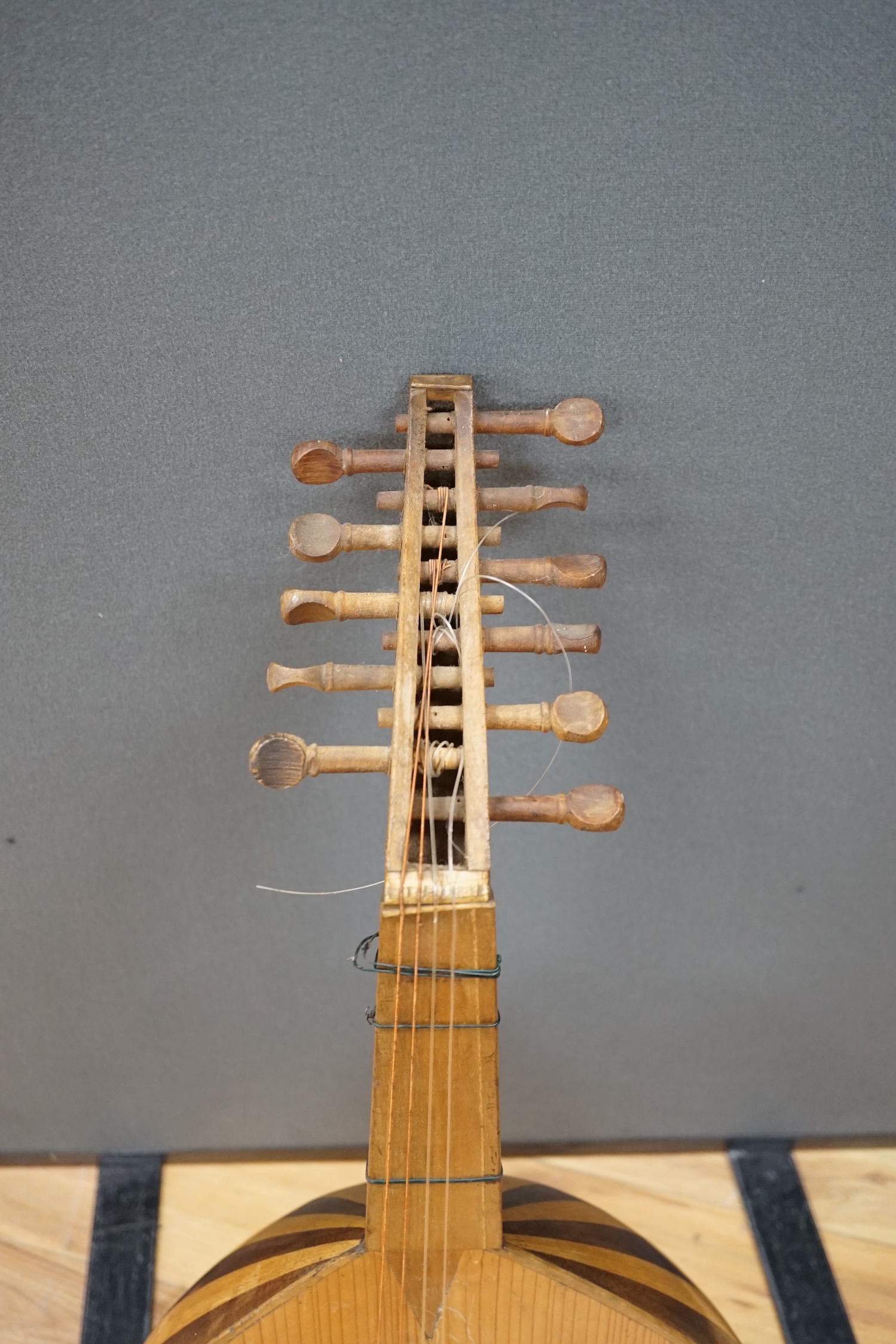 A Middle Eastern eleven string lute, overall length 82cm